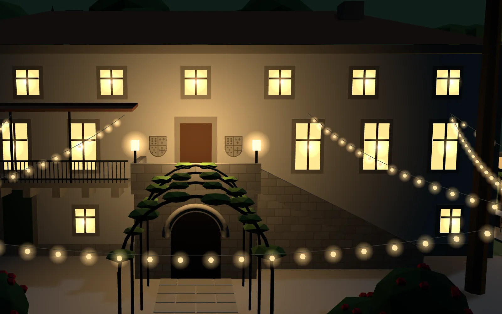 La fachada del pazo de noche, con las ventanas y las guirnaldas encendidas y los escudos junto a la puerta